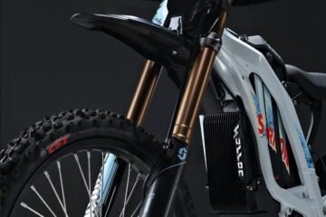 Surron electric dirt bike suspension fork and frame close-up